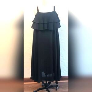Vintage Caron Chicago black sheer dress with tiered, ruffled bust. Size 6.